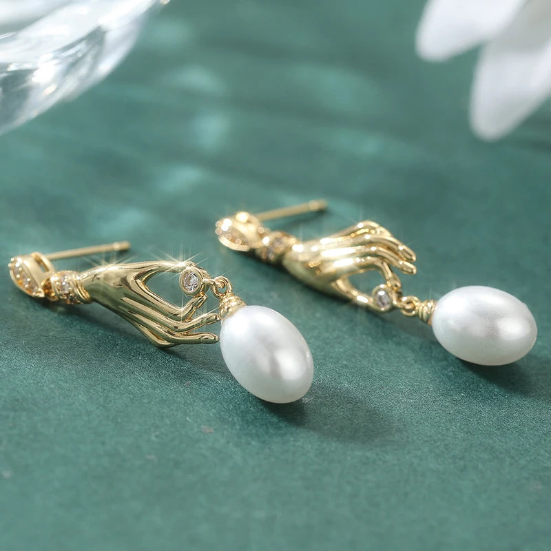Orecchini pendenti da donna con perla finta, dal design creativo a mano, accessorio di personalità alla moda, gioielli di temperamento per feste quotidiane