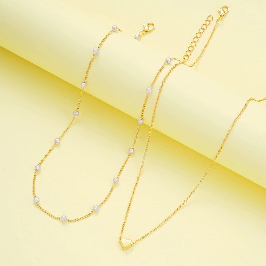 Set di gioielli a forma di cuore con perle finte per donne, collana e bracciale con perline rotonde color oro e argento, accessori per l'uso quotidiano