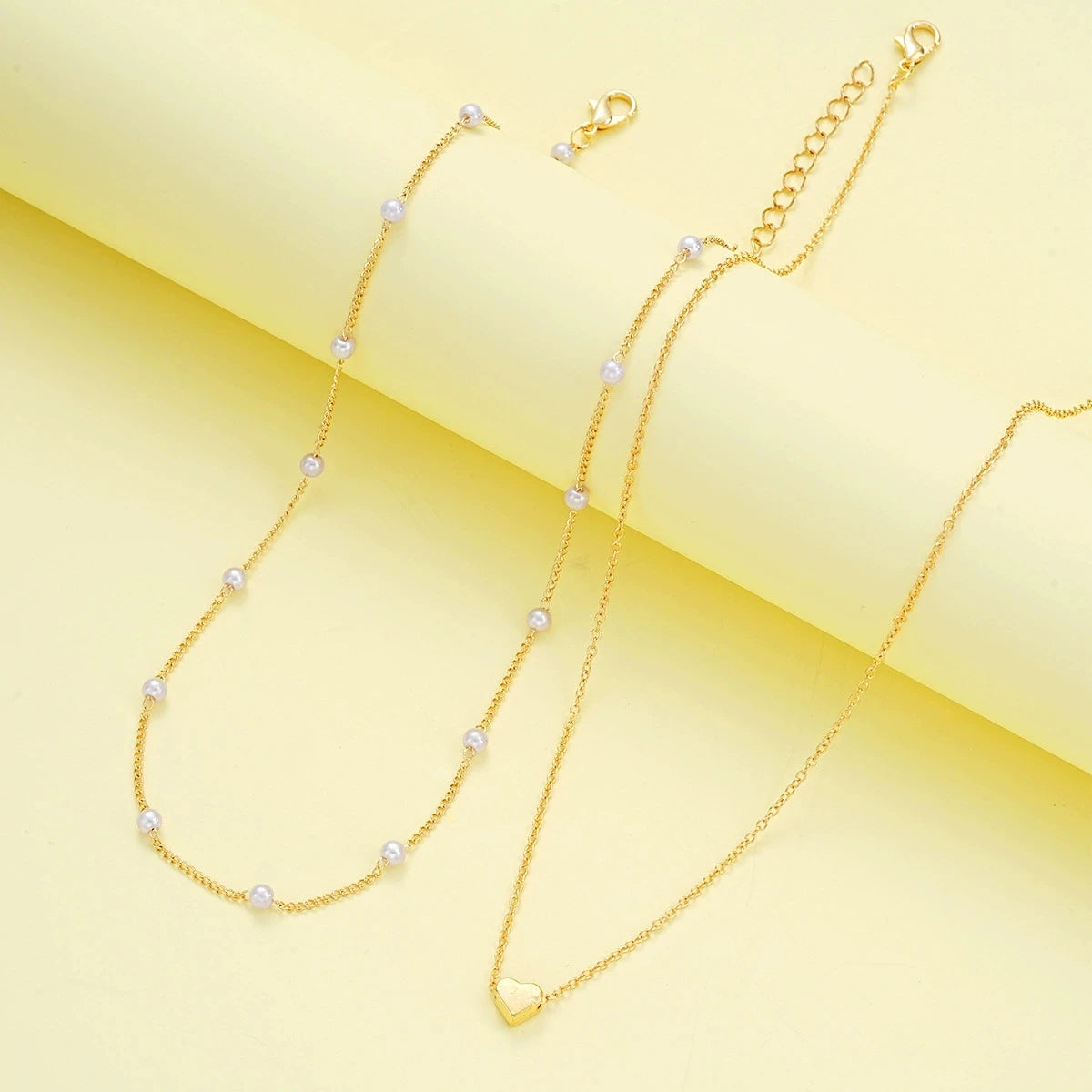Set di gioielli a forma di cuore con perle finte per donne, collana e bracciale con perline rotonde color oro e argento, accessori per l'uso quotidiano