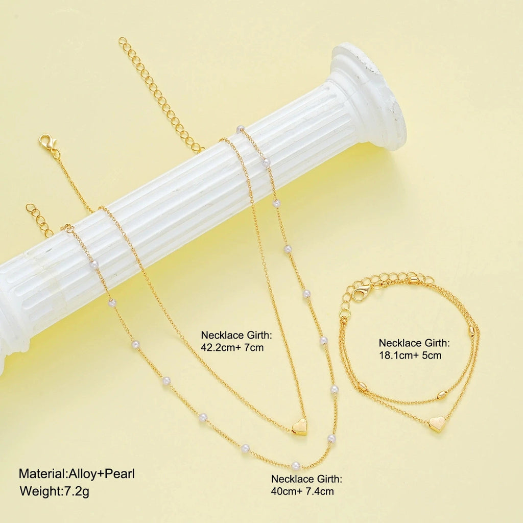 Set di gioielli a forma di cuore con perle finte per donne, collana e bracciale con perline rotonde color oro e argento, accessori per l'uso quotidiano