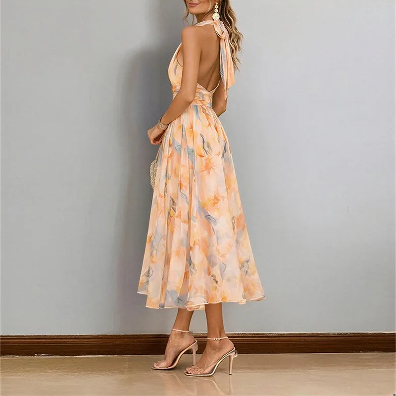 Abito lungo da donna senza schienale con spalline floreali e scollo all'americana in colore dopamina, stile temperamento, abito estivo da spiaggia di alta qualità per il mare