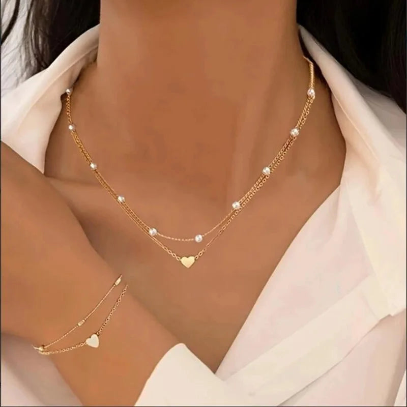 Set di gioielli a forma di cuore con perle finte per donne, collana e bracciale con perline rotonde color oro e argento, accessori per l'uso quotidiano